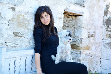 beautiful  young woman hugging her cute little havanese dog 