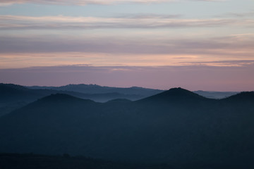 Fototapeta na wymiar Foggy hills in the morning