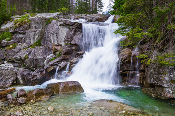 Obraz premium A gorgeous mountain waterfall.