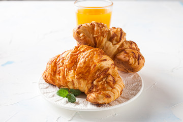 coffee and croissants on a table, selective focus