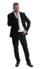 full length portrait of Senior businessman thinking