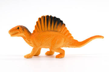 Spinosaurus toy model on white background © Noey smiley