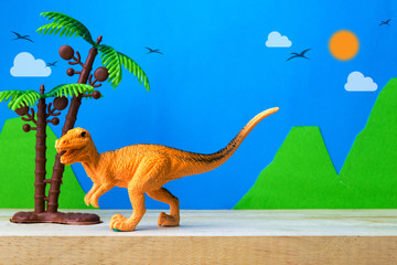 Velociraptor toy model on wild models background © Noey smiley