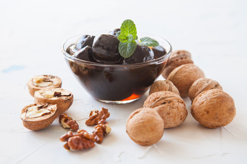 jam from walnuts in a bowl on a table, selective focus