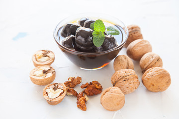 jam from walnuts in a bowl on a table, selective focus