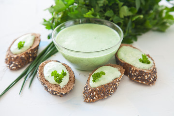 green vegetable cheese and sandwiches on a table, selective focus