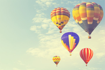 Obraz premium Hot air balloon on sun sky with cloud, vintage and retro instagram filter effect style