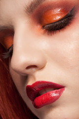 Close up portrait of girl with red make up