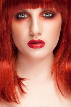 Woman with red wig and creative make up