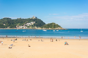 Fototapeta na wymiar View to Igeldo, a quarter of San Sebastian. It is a small town located at the hillside of the same name towering over the west side of the Bay of La Concha one of the famous urban beaches in Europe