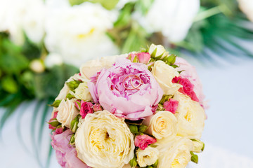 two wedding rings on bridal bouquet