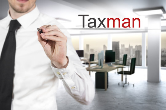 Businessman Writing Taxman In The Air