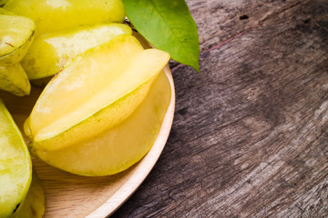 green fruit with leaves. On a wooden table. copy space for text . Top view