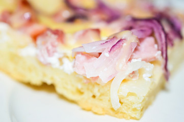 Fototapeta na wymiar Delicious homemade sour cream pizza with ham and sliced red onions