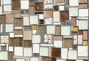 Colorful mosaic on the wall, abstract glass background.