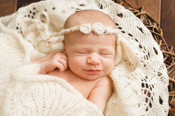 Fototapeta na wymiar Incredible and sweet newborn baby sleeps in basket