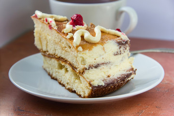 Homemade cake in white plate and tea