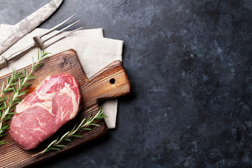 Raw beef steak cooking