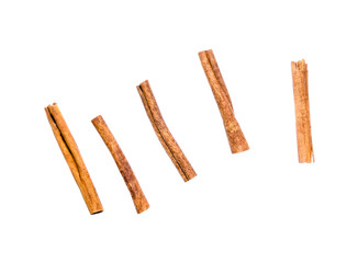 Top view set of multiple cinnamon sticks isolated on white background. Spice, winter detail.