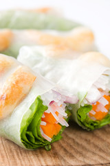 Vietnamese rolls with vegetables, rice noodles and prawns isolated on white background

