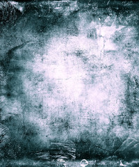 Grunge vintage blue abstract scratched textured background with faded central area for your text or picture
