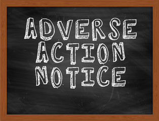 ADVERSE ACTION NOTICE handwritten text on black chalkboard