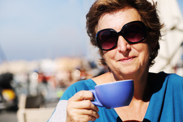 Outdoor portrait of 70 years old woman