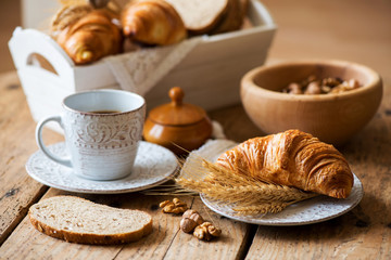 breakfast with freshly baked croissants - vintage style
