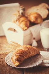 breakfast with freshly baked croissants - vintage style