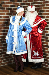 Happy Santa Claus and snow girl