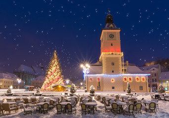 Beautiful Christmas market and tree in Brasov town in winter season. Romania