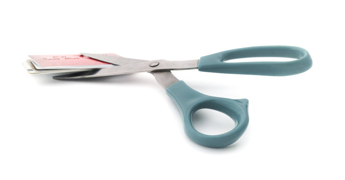 Cutting Credit Card Debt
Isolated Scissors With Credit Cards.