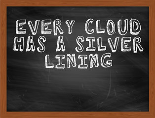 EVERY CLOUD HAS A SILVER LINING handwritten text on black chalkb