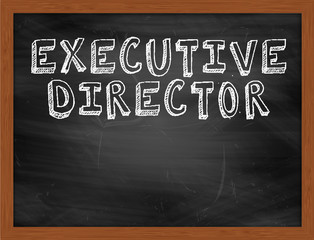 EXECUTIVE DIRECTOR handwritten text on black chalkboard