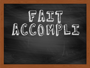 FAIT ACCOMPLI handwritten text on black chalkboard