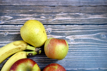 Healthy fruits on wooden background with copy space 