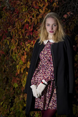 Young woman enjoying an autumn day in the park