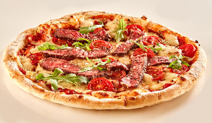Strips of beef and fresh lettuce on pizza