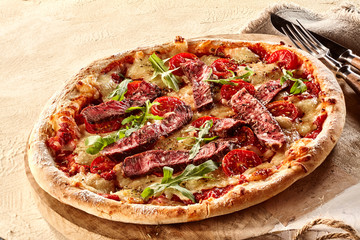 Specialty beef steak and arugula pizza
