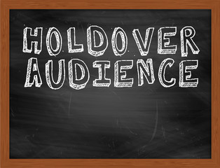 HOLDOVER AUDIENCE handwritten text on black chalkboard