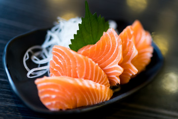 Sliced salmon sashimi, Japanese raw food delicious menu, famous fish from Norway - obrazy, fototapety, plakaty