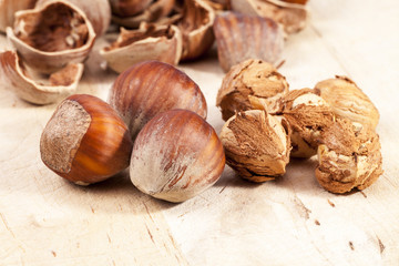 Composition of hazelnuts on wooden plank