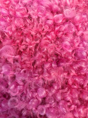Fluffy pink wool which can be used as a background. Space for text.
