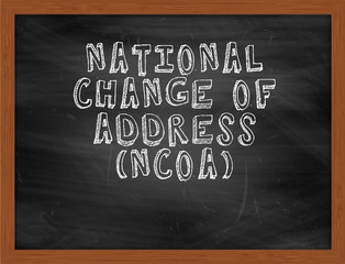 NATIONAL CHANGE OF ADDRESS NCOA handwritten text on black chalkb