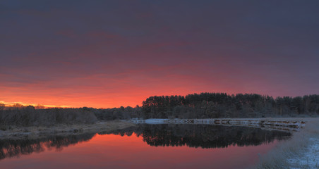 Autumn sunrise over lake