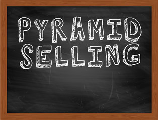 PYRAMID SELLING handwritten text on black chalkboard