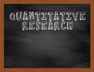 QUANTITATIVE RESEARCH handwritten text on black chalkboard