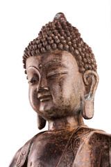 A head of Buddha Shakyamuni's. The old statue made of metal isolated on a white background.