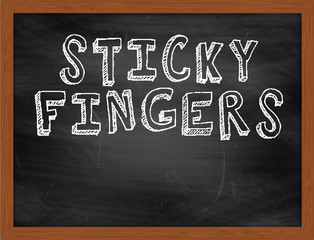 STICKY FINGERS handwritten text on black chalkboard