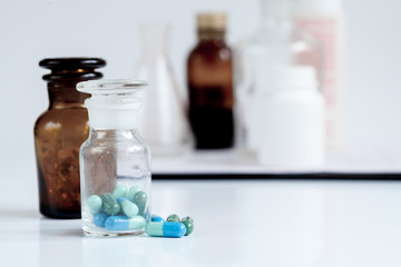 glass jars of pills - home first aid kit